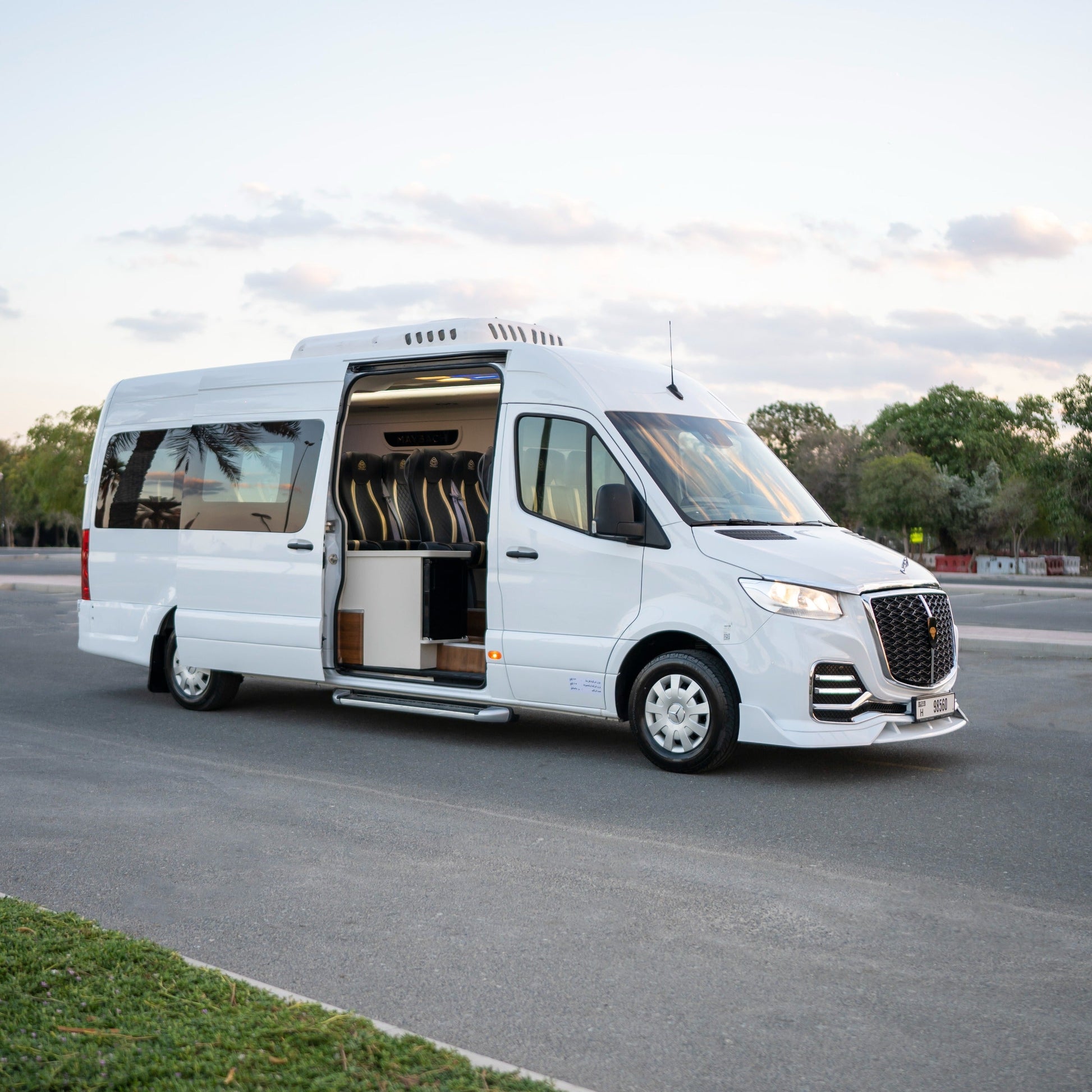 Side angle view of Mercedes Maybach Sprinter 14-seater van