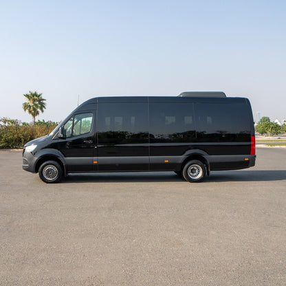 Side profile of Elite Sprinter 19 parked for VIP pickup