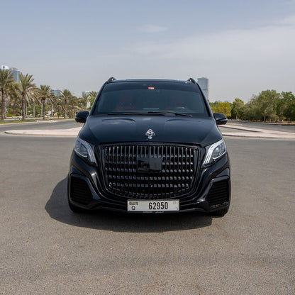 Chauffeur-driven Maybach Signature van at Dubai Airport for private transfer