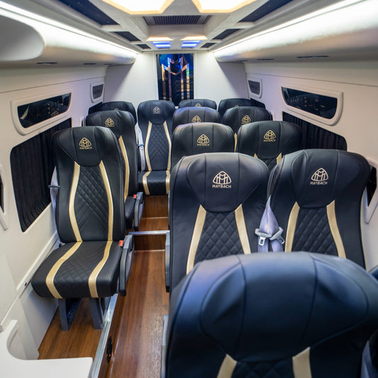 Reclining leather seats inside Maybach Sprinter 14-seater van