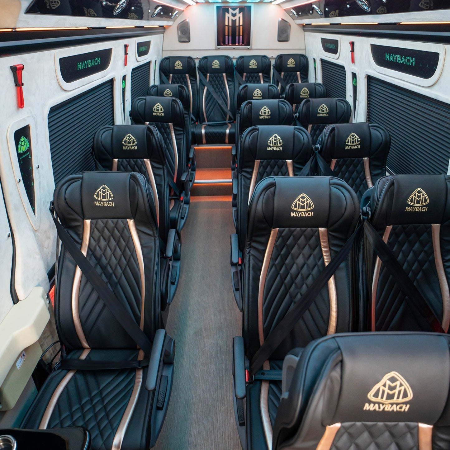 Luxury leather reclining seats inside Maybach Sprinter 19-seater van