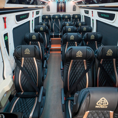 Luxury leather reclining seats inside Maybach Sprinter 19-seater van