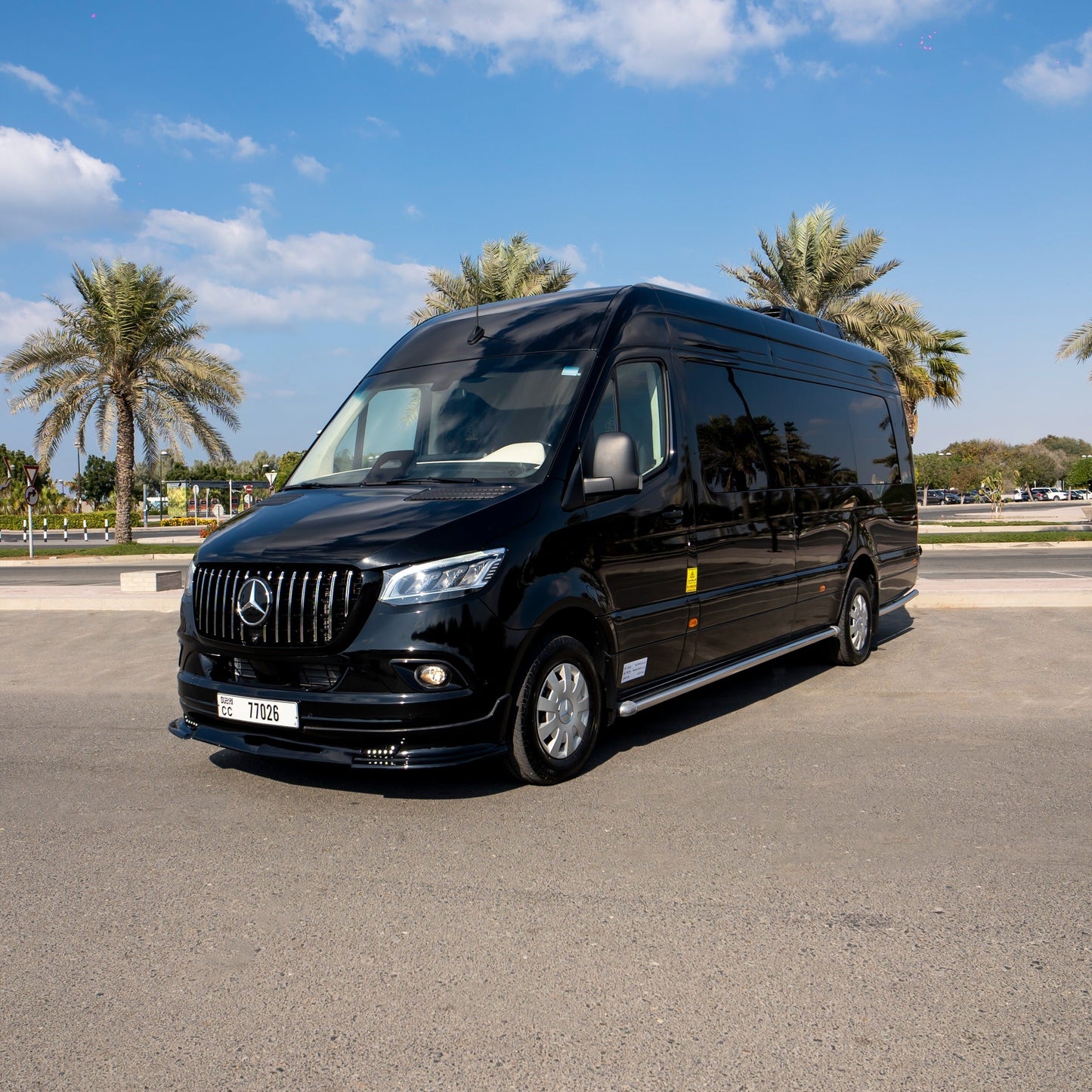 Chauffeur-driven Maybach Sprinter van parked outside a Dubai