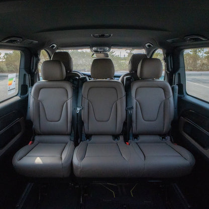 v250 elite behind captain seats and spacious layout inside V250 Elite chauffeur van